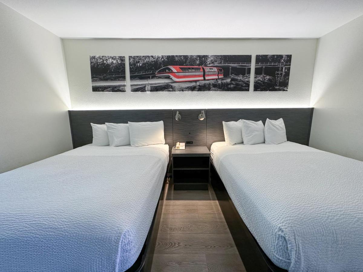 Queen Room with Two Queen Beds and a Bunk Bed - Non-Smoking at Ramada by Wyndham Anaheim Convention Center
