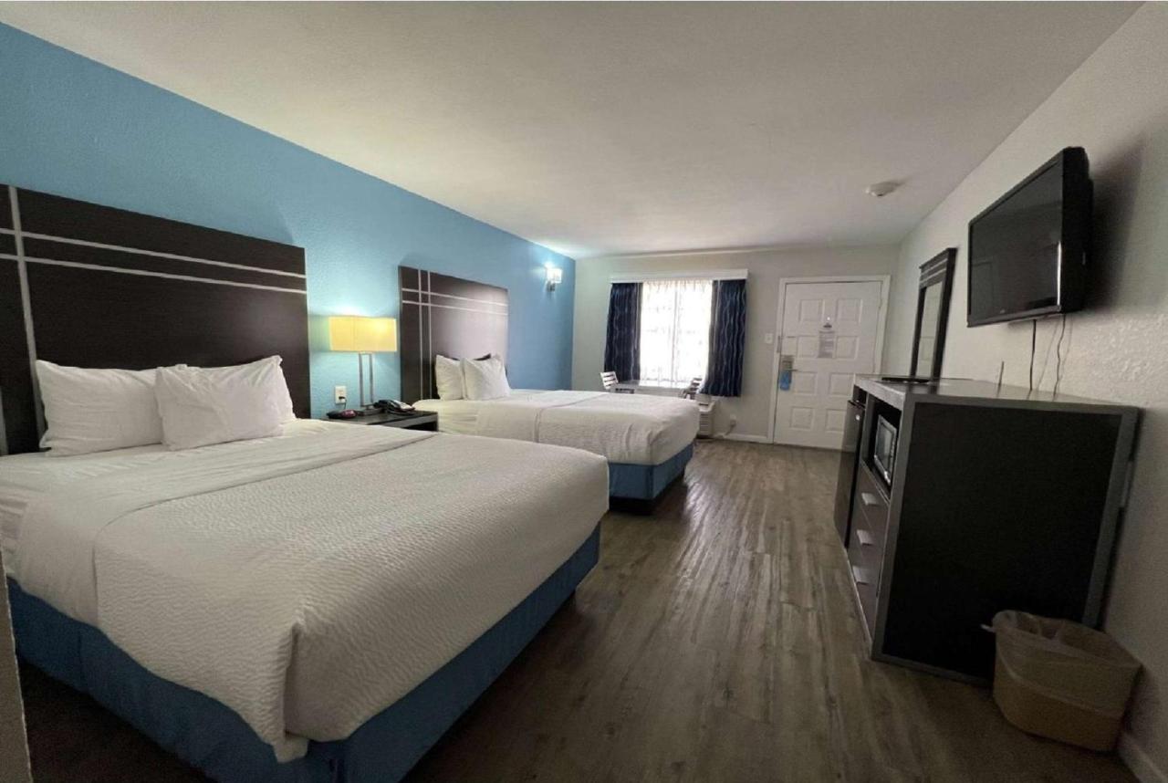 Superior Double Room with Three Double Beds - Non-Smoking at Days Inn by Wyndham Orange