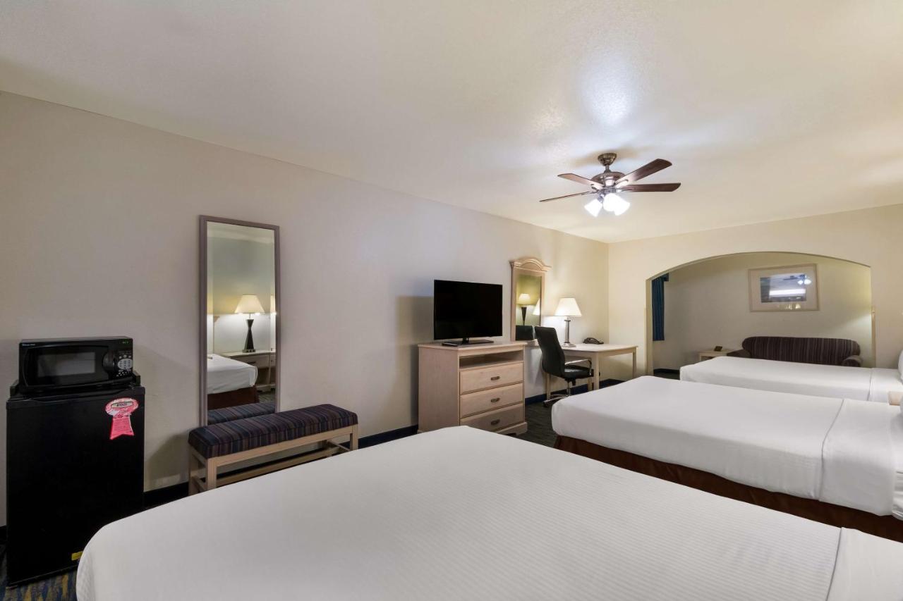 Queen Room with Three Queen Beds at SureStay Hotel by Best Western Falfurrias