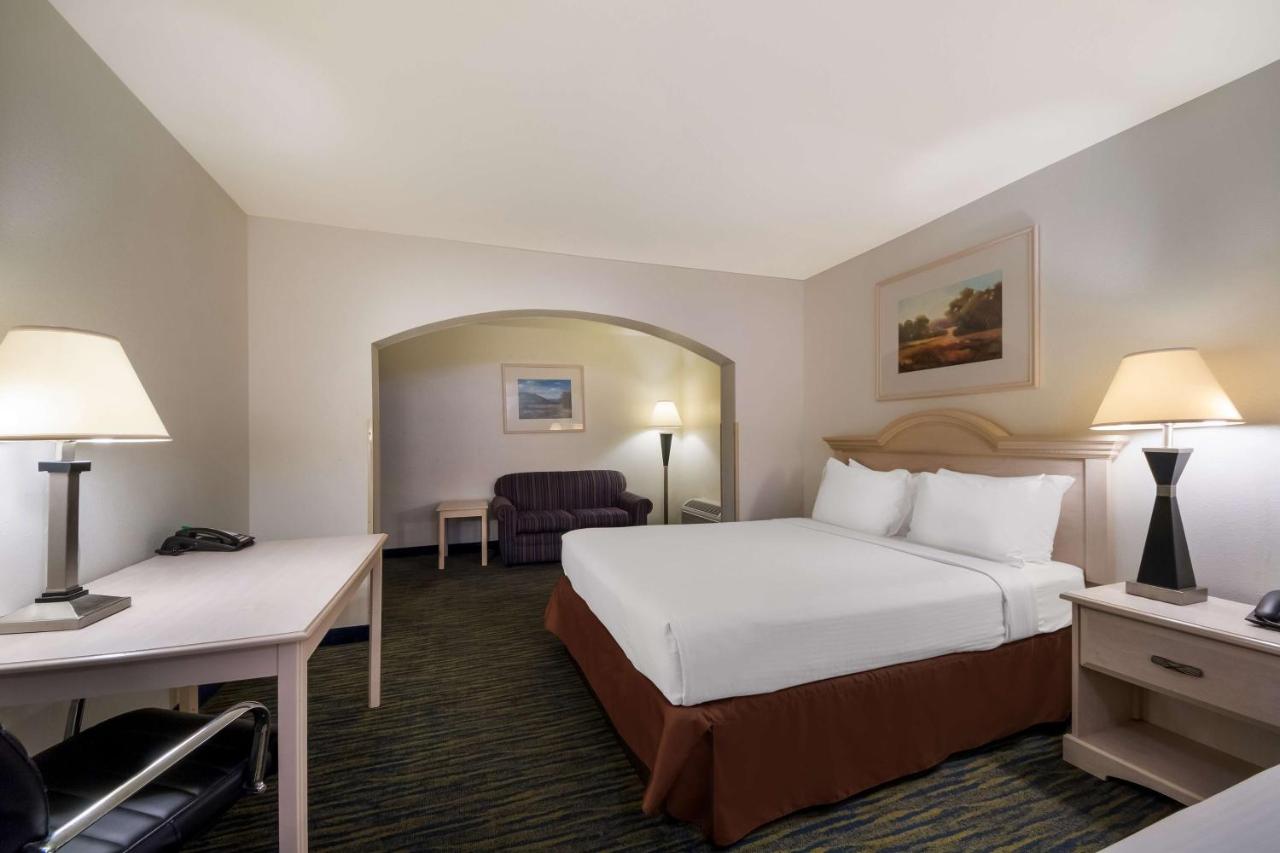 Queen Room with Three Queen Beds at SureStay Hotel by Best Western Falfurrias