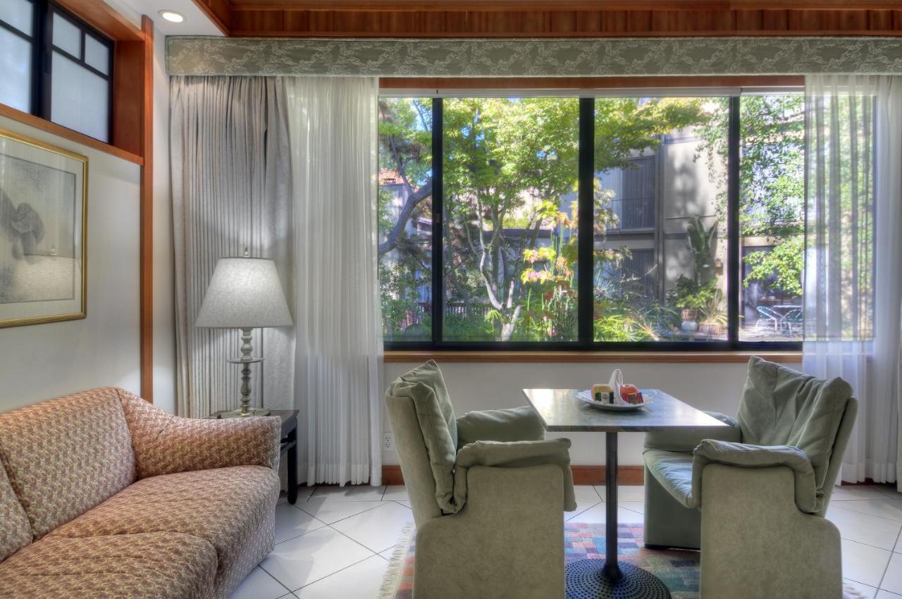 King Suite with Fireplace at Dinah's Garden Hotel