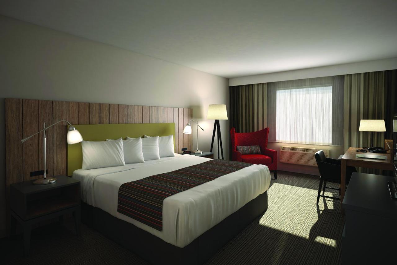 King Room at Country Inn & Suites by Radisson, Chippewa Falls, WI