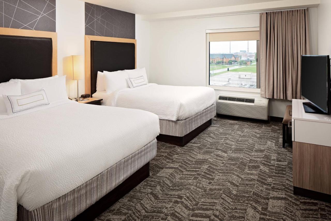 One Bedroom Queen Suite with Two Queen Beds and Sofa bed at SpringHill Suites Green Bay