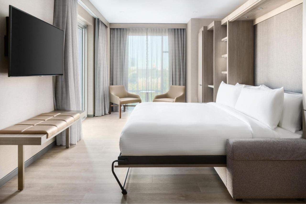 King Suite with Balcony and City View at AC Hotel by Marriott Raleigh Downtown