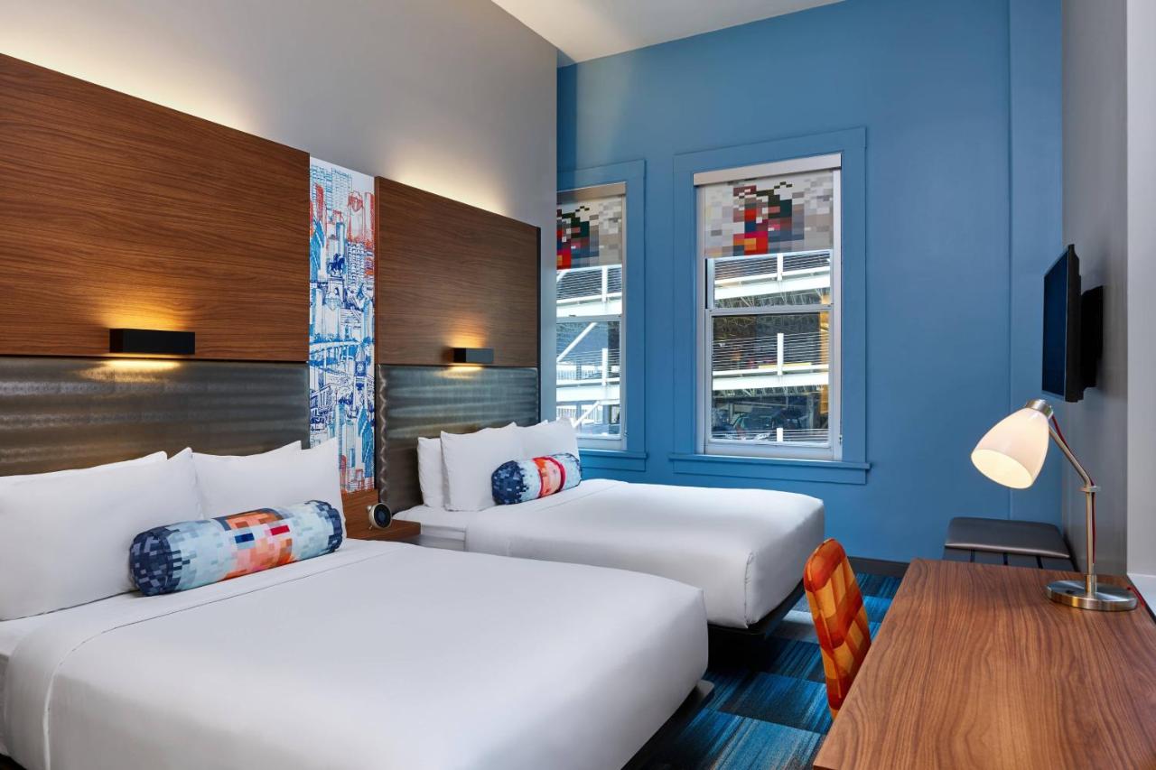 Queen Room with Two Queen Beds - Hearing Accessible at Aloft by Marriott Houston Downtown