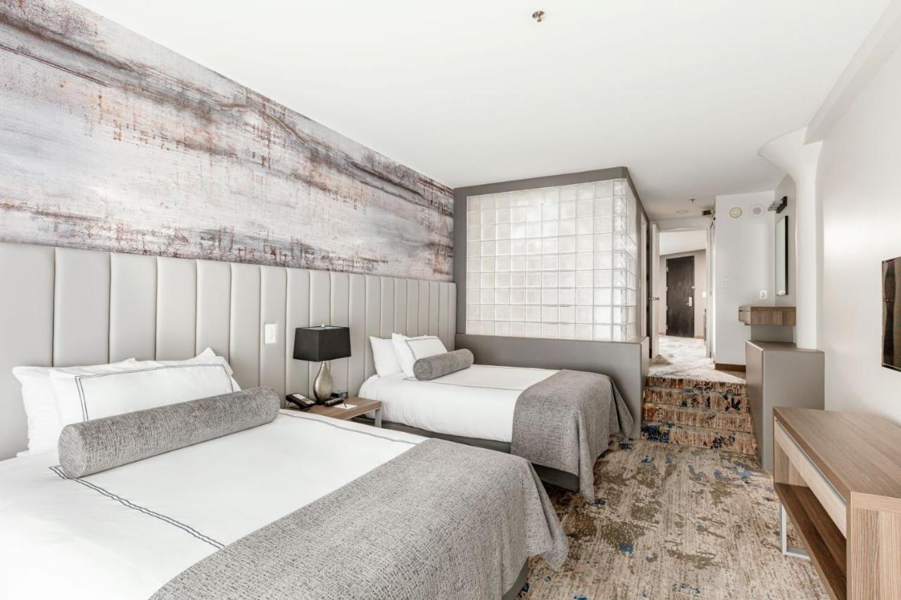 Queen Suite with Two Queen Beds at Atheneum Suite Hotel