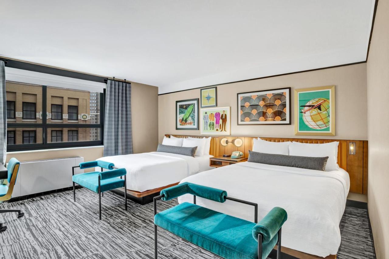 Queen Room with Two Queen Beds and Mobility Accessible Roll-In Shower at Hotel Indigo Minneapolis Downtown by IHG