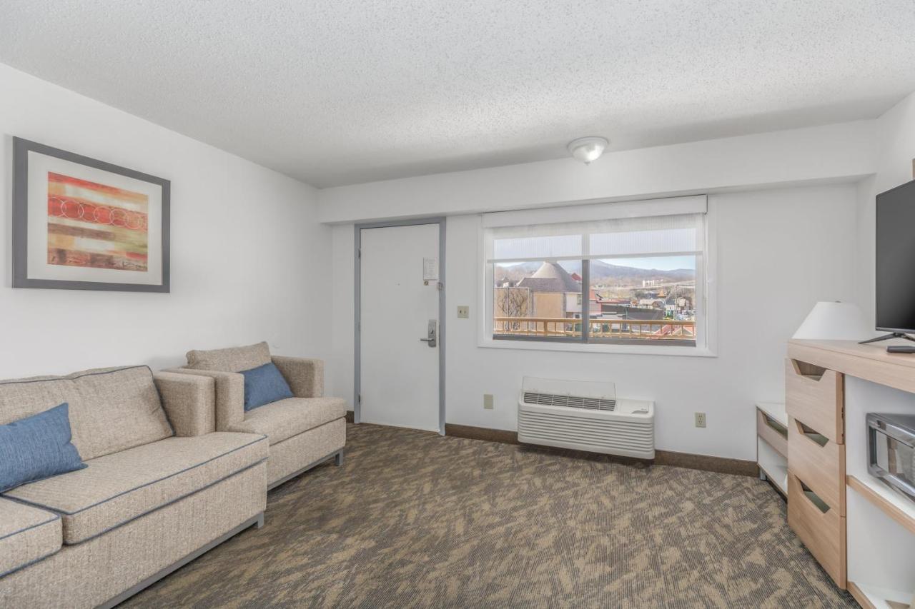King Suite with seasonal fireplace at Crossroads Inn & Suites