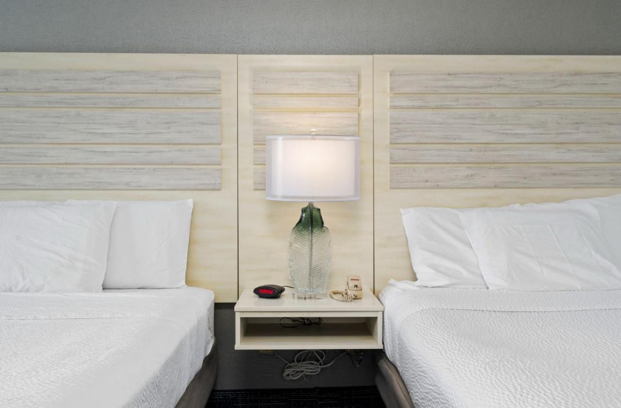 Balcony Two Queen Beds and Sofa Bed with Side Ocean View at Hotel Monte Carlo Ocean City