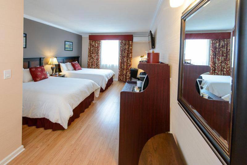 Queen Room with Two Queen Beds at Norwalk Inn & Conference Center