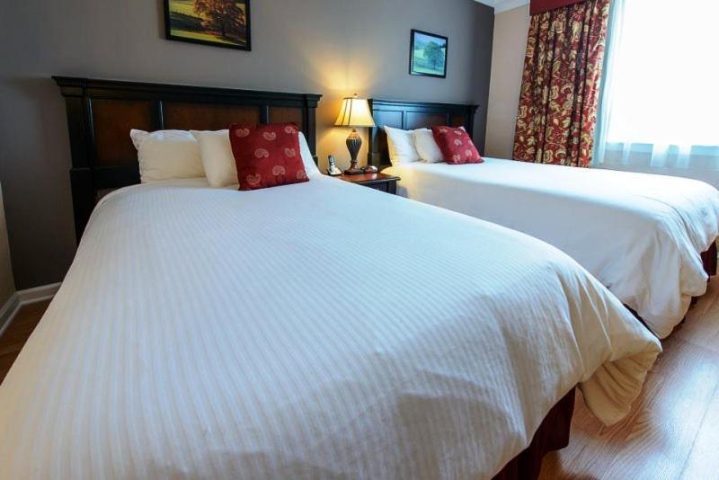 Queen Room with Two Queen Beds at Norwalk Inn & Conference Center