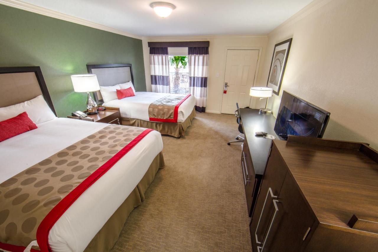 Queen Room - Two Queen Beds Pool View Non Smoking at Ramada by Wyndham Houston Intercontinental Airport East