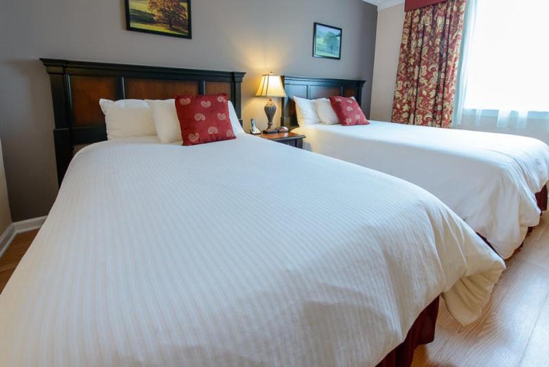 Queen Room with Two Queen Beds at Norwalk Inn & Conference Center