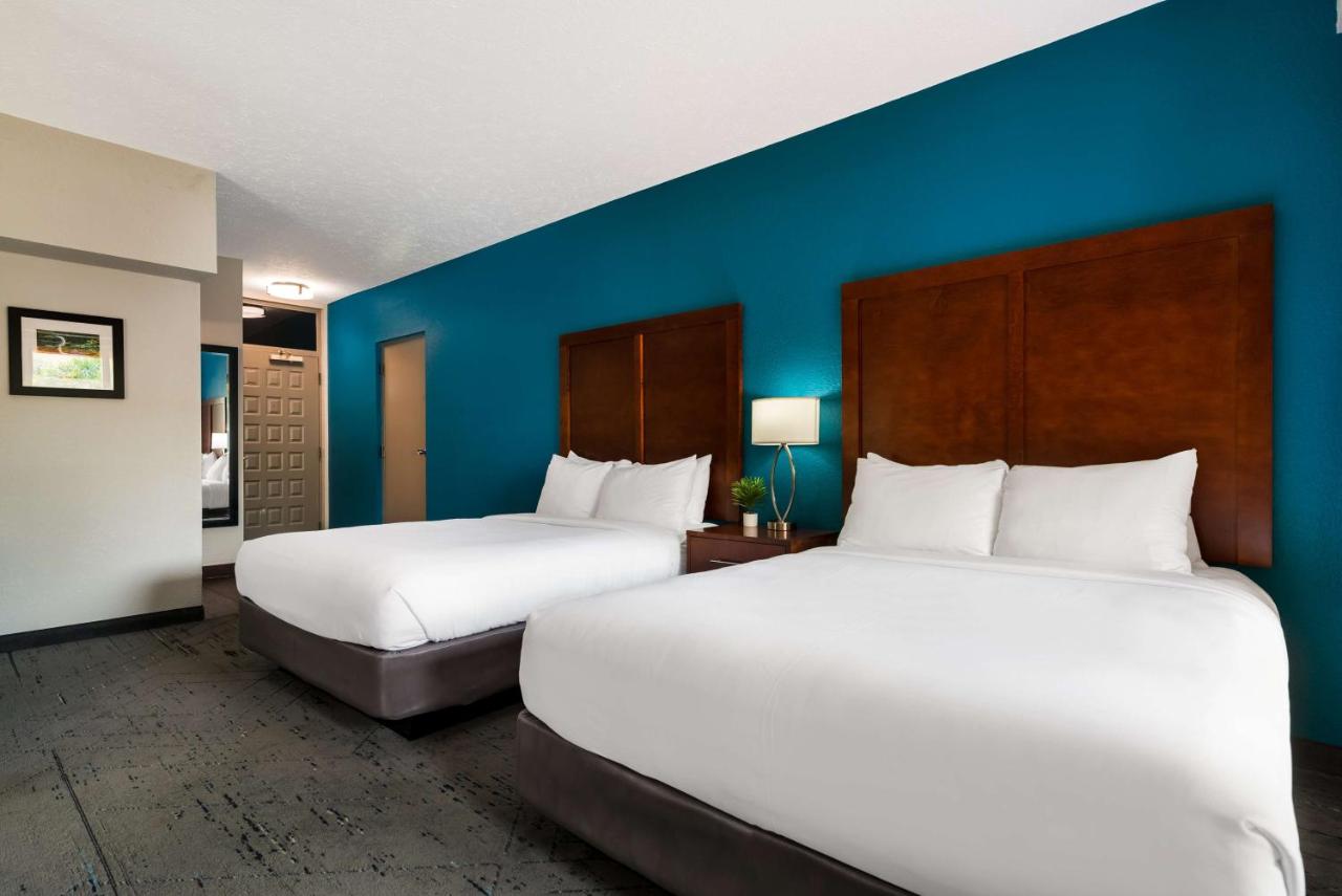 Queen Room with Two Queen Beds and Balcony at SureStay Plus Hotel by Best Western The Villages