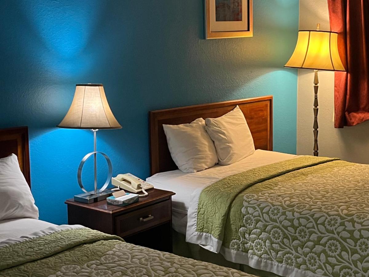 Queen Room with Two Queen Beds - Non-Smoking at Rodeway Inn