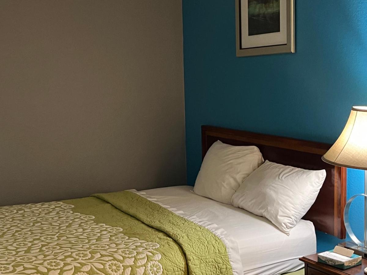 Queen Room with Two Queen Beds - Non-Smoking at Rodeway Inn