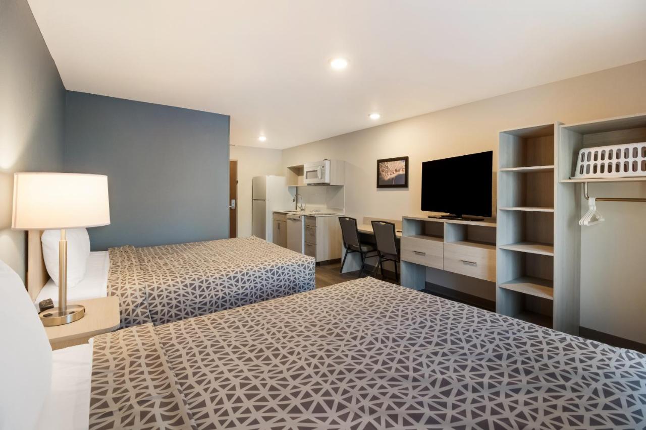 Quadruple Room with Two Queen Beds - Non Smoking at WoodSpring Suites Concord-Charlotte Speedway