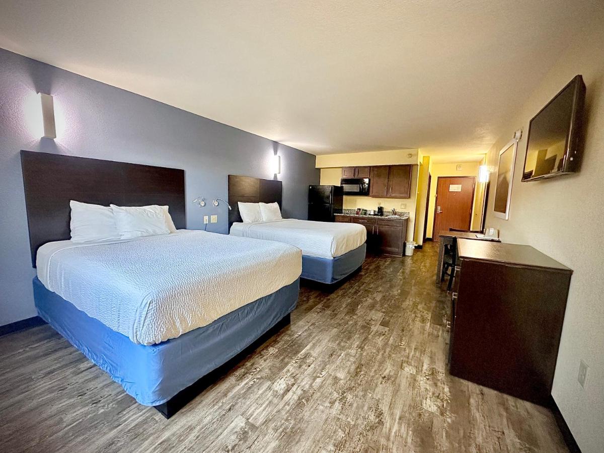 Queen Room with Two Queen Beds and Kitchenette - Non-Smoking at Days Inn by Wyndham New Orleans Pontchartrain