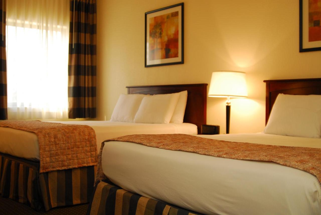 Queen Room with Two Queen Beds- Non-Smoking at Ramada by Wyndham Bettendorf