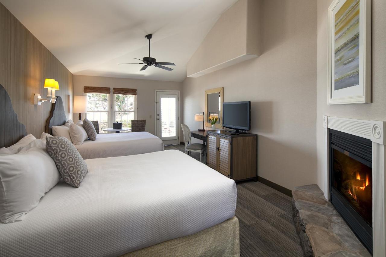 King Room with Two King Beds at Cottage Inn By The Sea