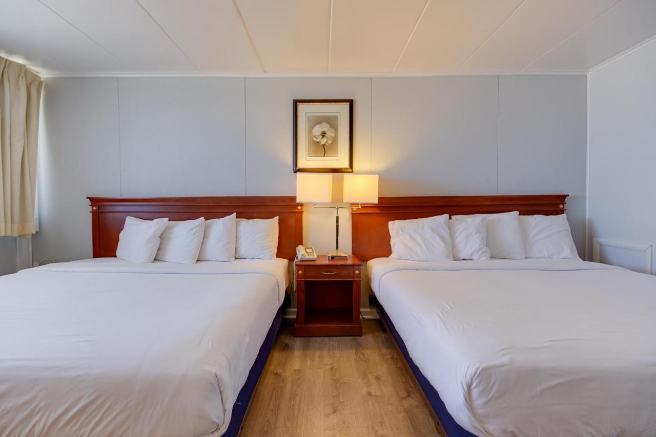 Double Room with Two King Beds with Balcony - Street View at Rideau Oceanfront Motel
