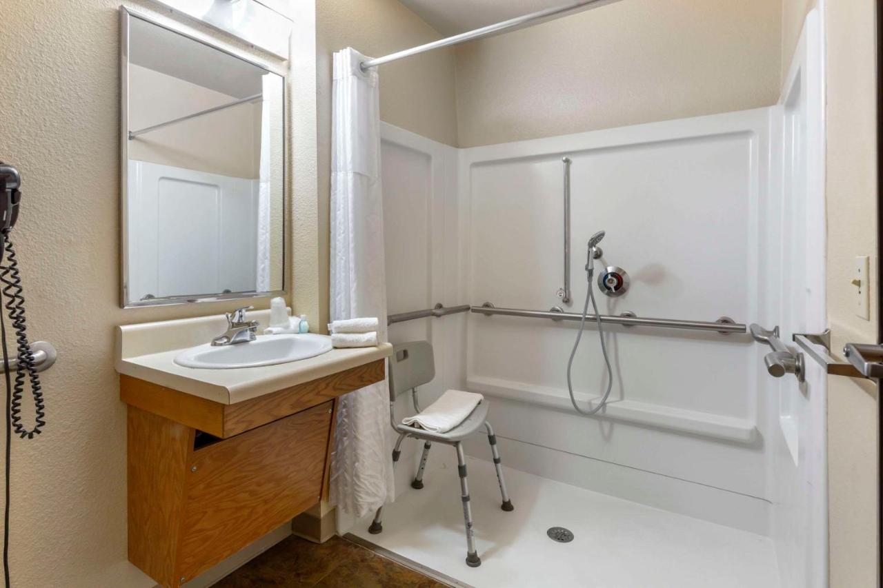Queen Room - Accessible/Non-Smoking at WoodSpring Suites Raleigh Garner