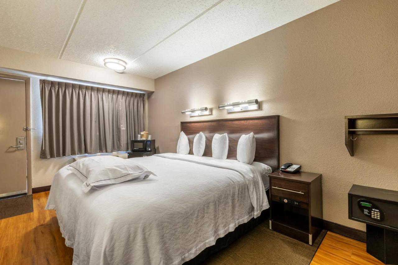 Premium King Room Disability Access Roll-In Shower Smoke Free (Upgraded Bedding & Snack) at Red Roof Inn PLUS+ Nashville Airport