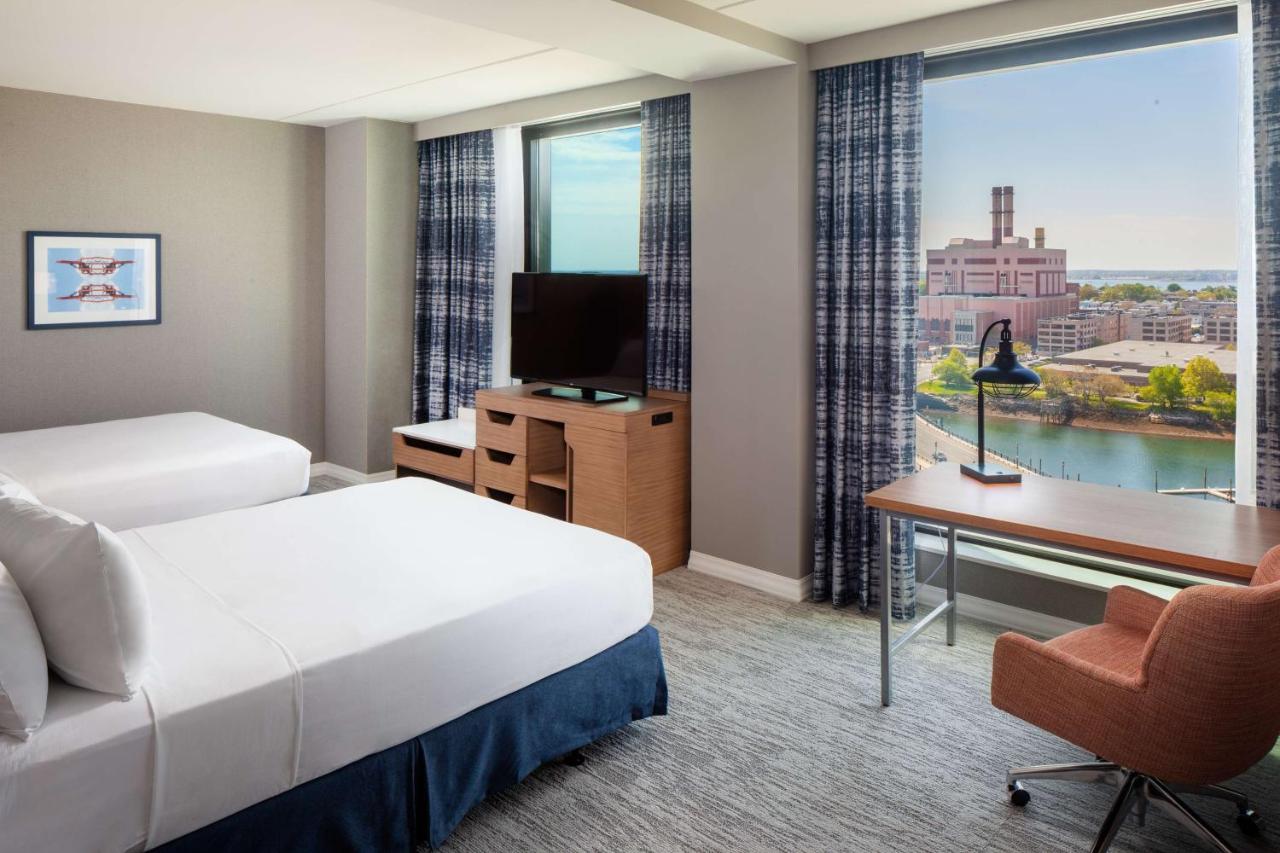 Queen Room with Two Queen Beds with Sofa Bed and Water View - Mobility Accessible at Hampton by Hilton at the Boston Seaport District