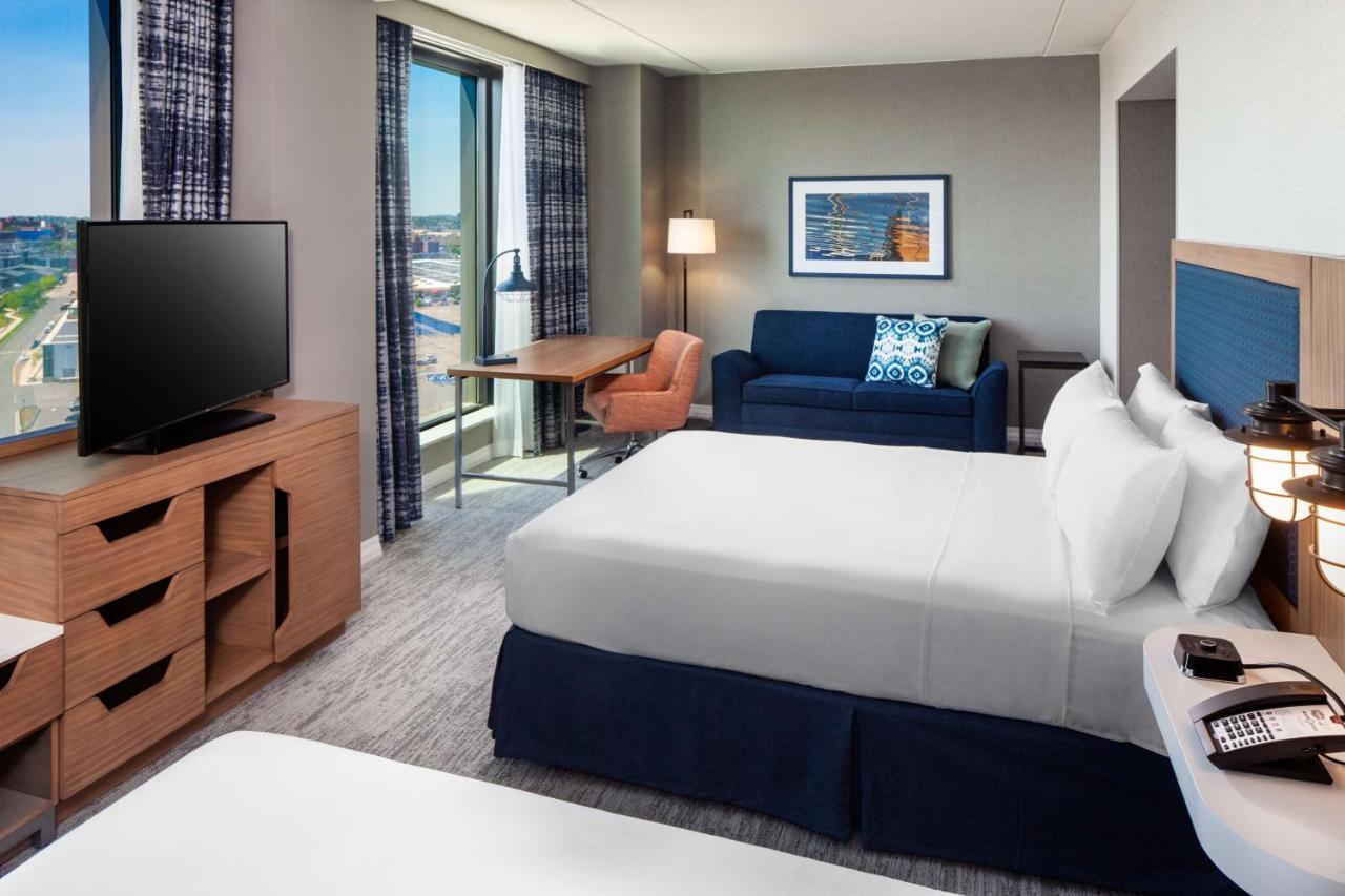 Queen Room with Two Queen Beds with Sofa Bed and Water View - Mobility Accessible at Hampton by Hilton at the Boston Seaport District