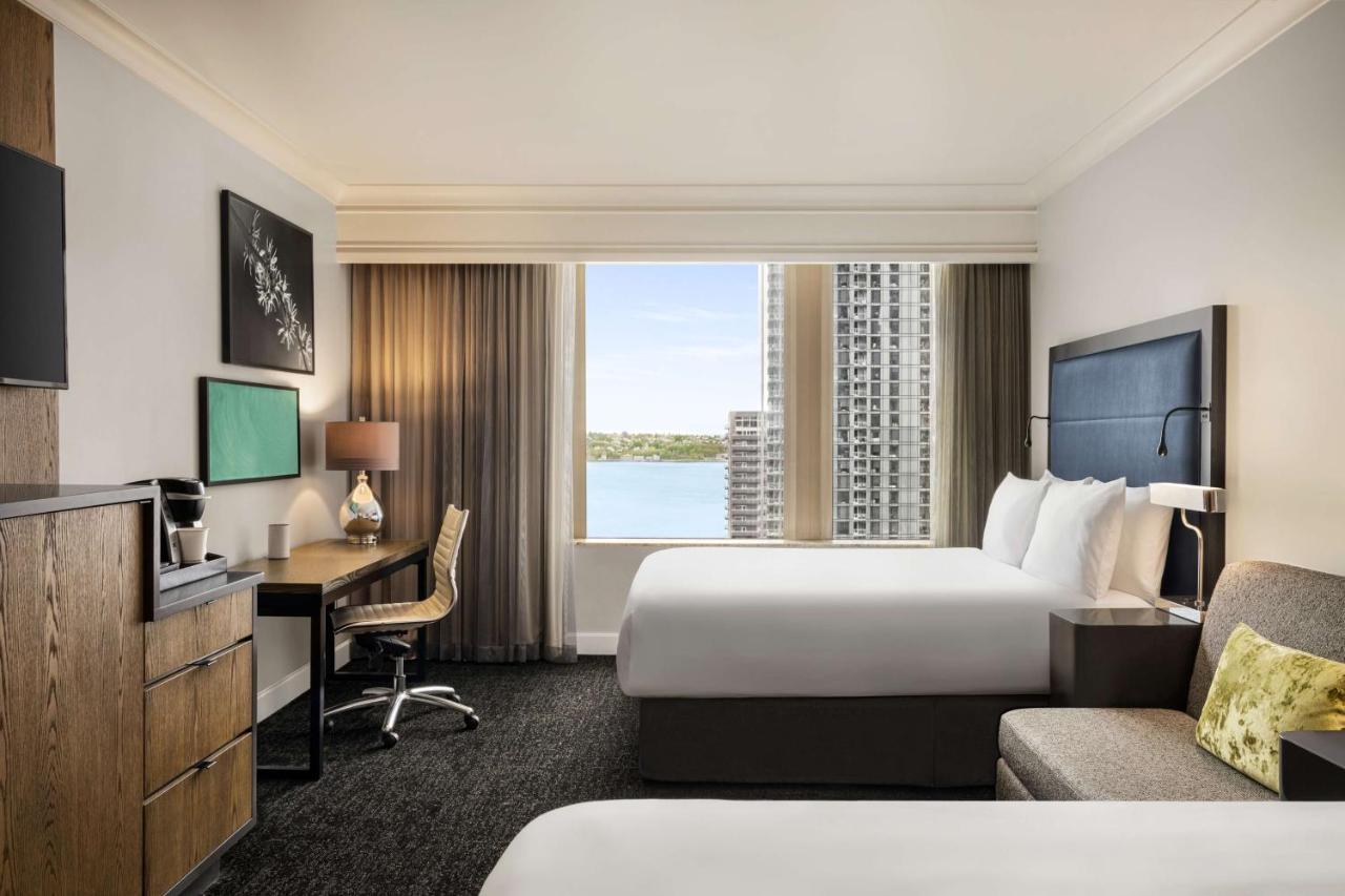 Queen Room with Two Queen Beds - Partial Water and Skyline View at Hilton Motif Seattle
