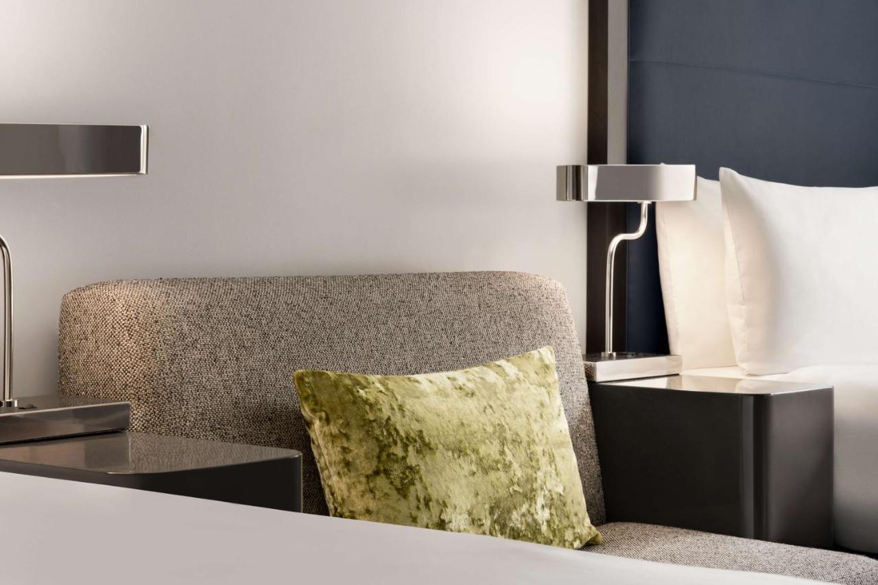 Queen Guestroom with Two Queen Beds and Skyline View at Hilton Motif Seattle