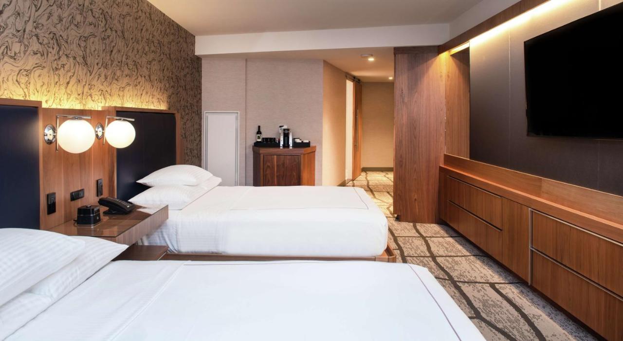 Corner Queen Room with Two Queen Beds at The Charter Hotel Seattle, Curio Collection by Hilton