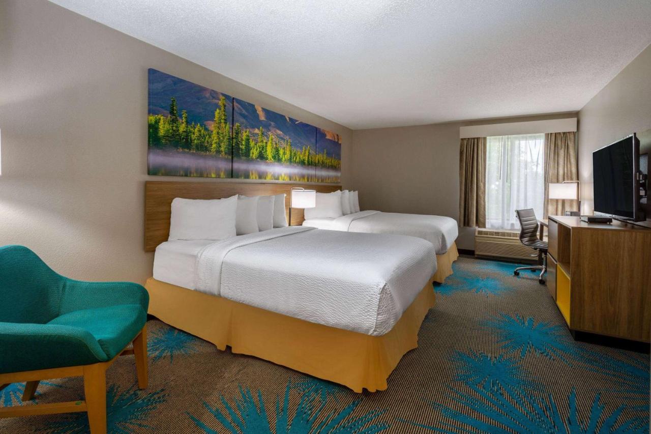 Queen Room with Two Queen Beds - Non-Smoking at Days Inn & Suites by Wyndham Denver International Airport