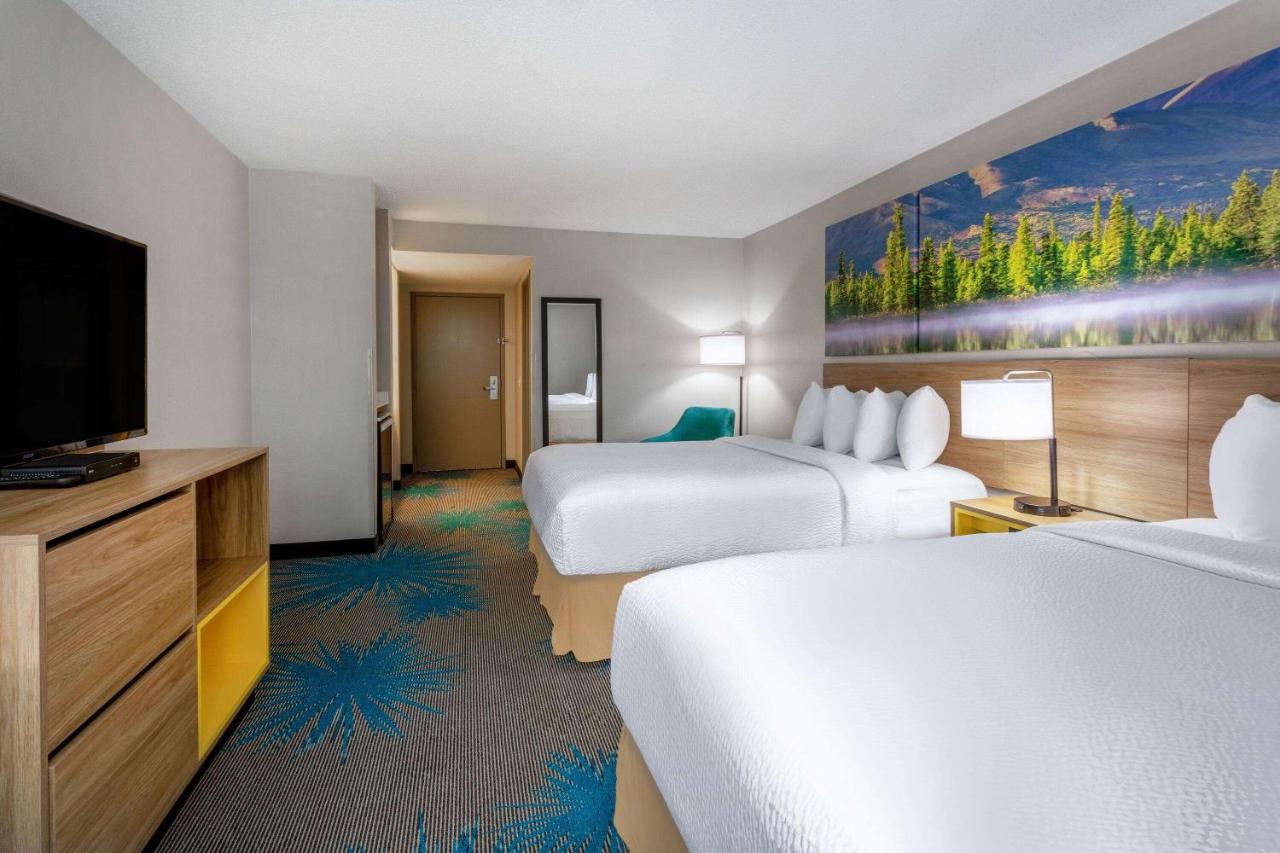 Queen Room with Two Queen Beds - Non-Smoking at Days Inn & Suites by Wyndham Denver International Airport