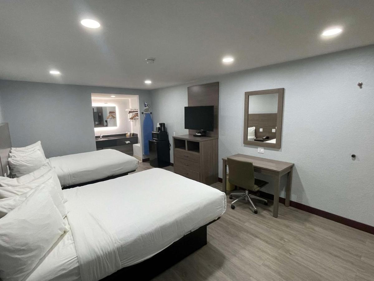 Queen Room with Two Queen Beds at SureStay Hotel by Best Western Childress