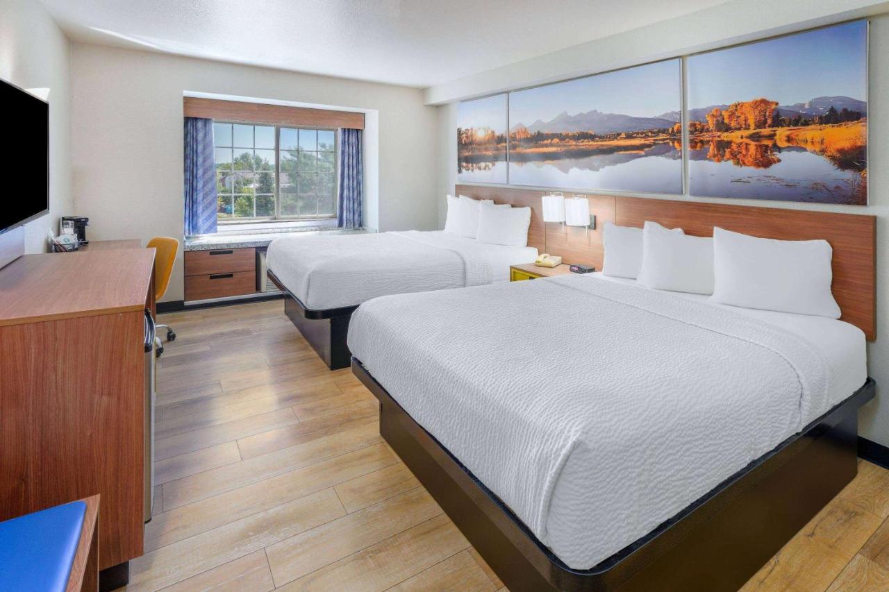 Queen Room with Two Queen Beds - Non-Smoking at Days Inn & Suites by Wyndham Greeley