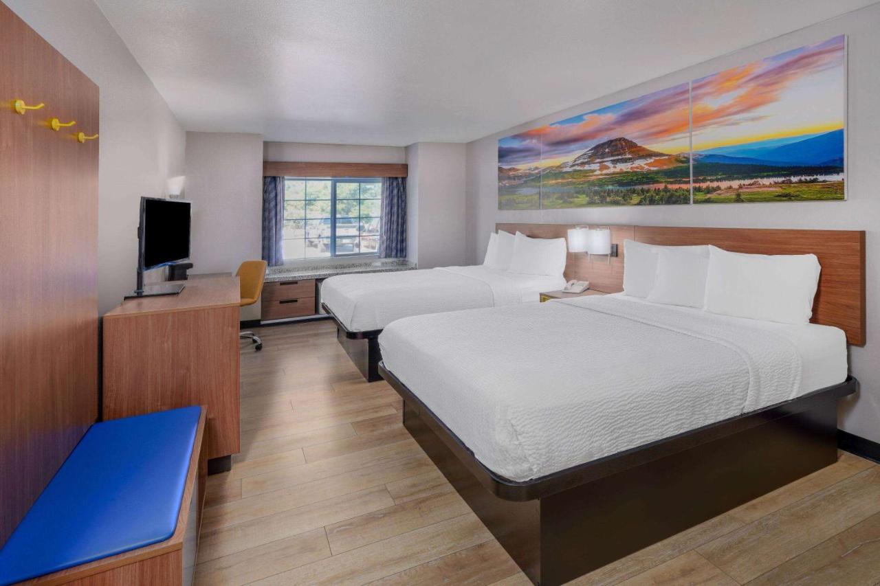 Queen Room with Two Queen Beds - Mobility Access/Non-Smoking at Days Inn & Suites by Wyndham Greeley