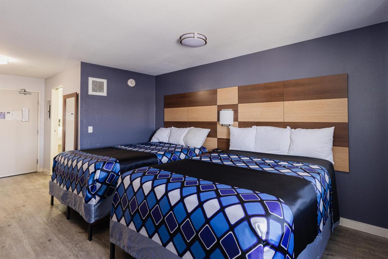 Deluxe Queen Room with Two Queen Beds at Coratel Inn and Suites By Jasper Saint Paul Minneapolis Inver Grove Heights.