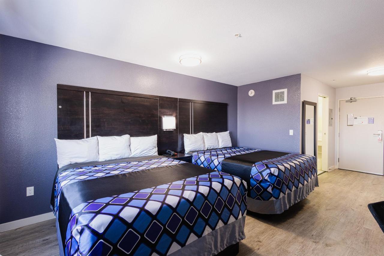 Deluxe Queen Room with Two Queen Beds at Coratel Inn and Suites By Jasper Saint Paul Minneapolis Inver Grove Heights.