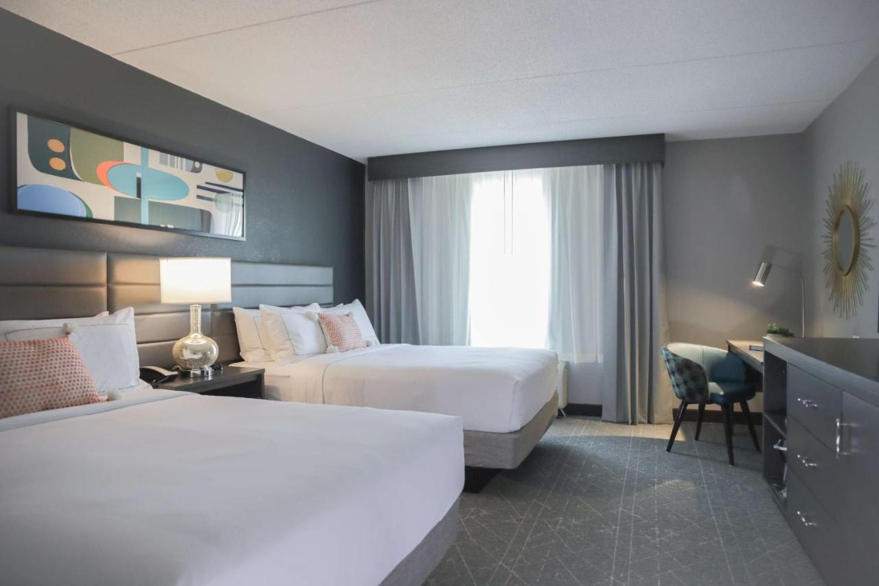 Queen Room with Two Queen Beds at The Rewind West Des Moines, Tapestry Collection by Hilton