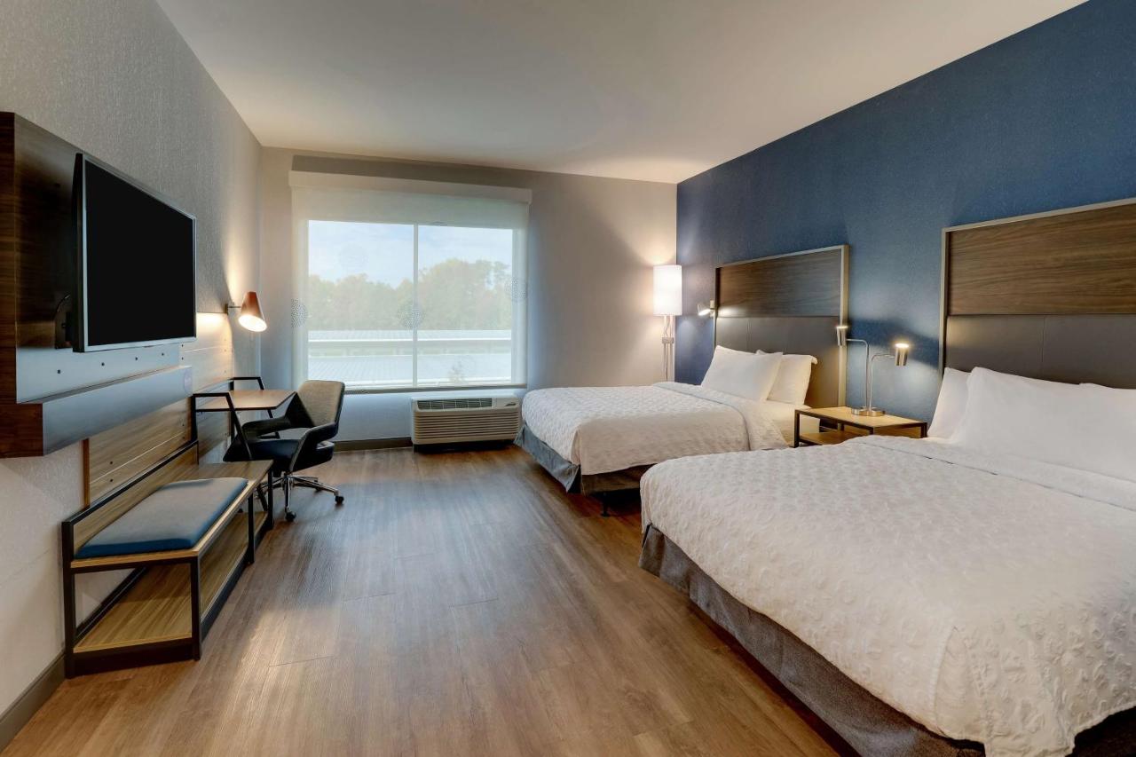 Queen Room with Two Queen Beds and Walk In Shower at Tru By Hilton Raleigh Garner