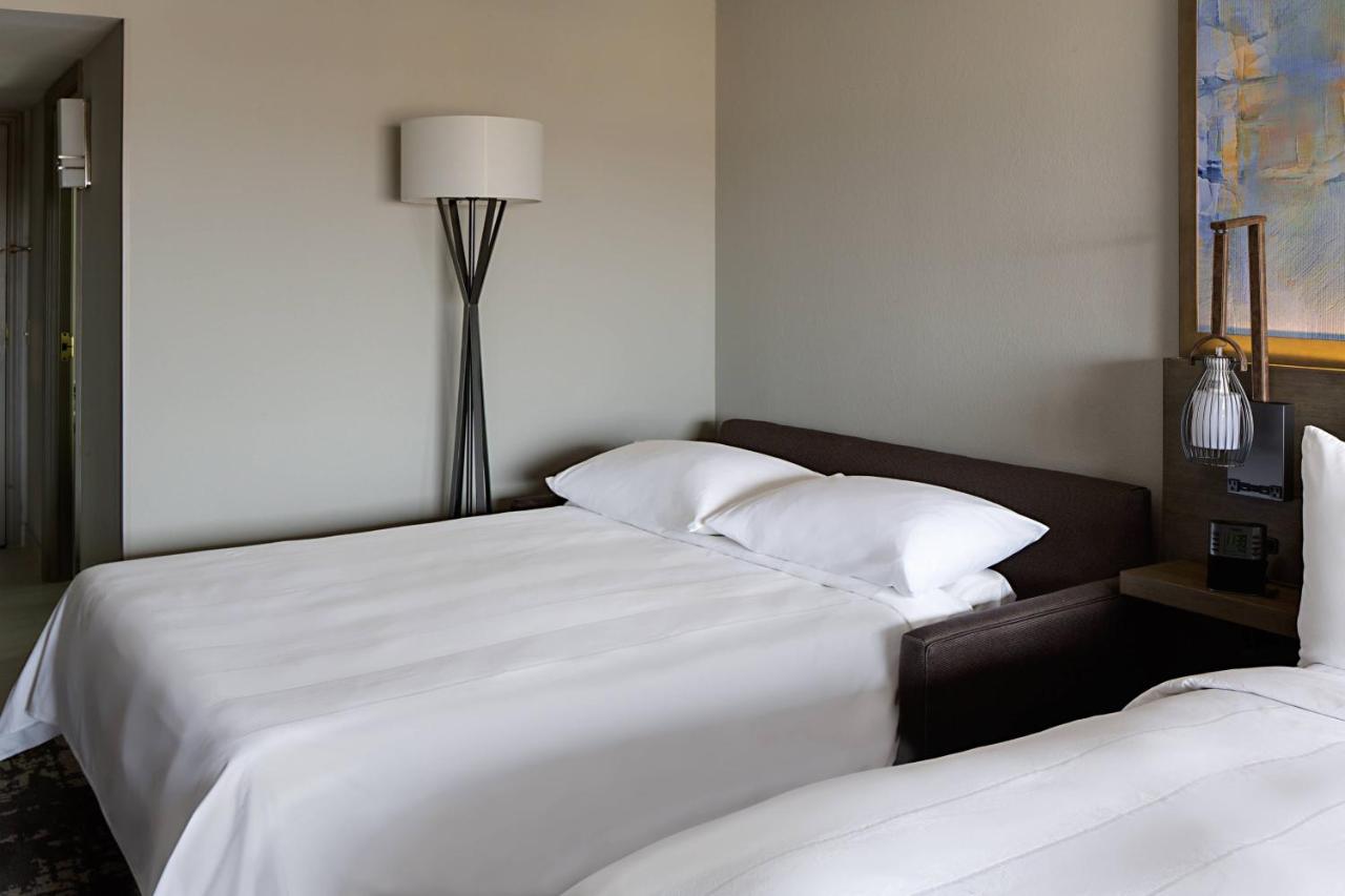 Queen Room with Two Queen Beds and Sofa-Bed at Marriott Dallas Las Colinas