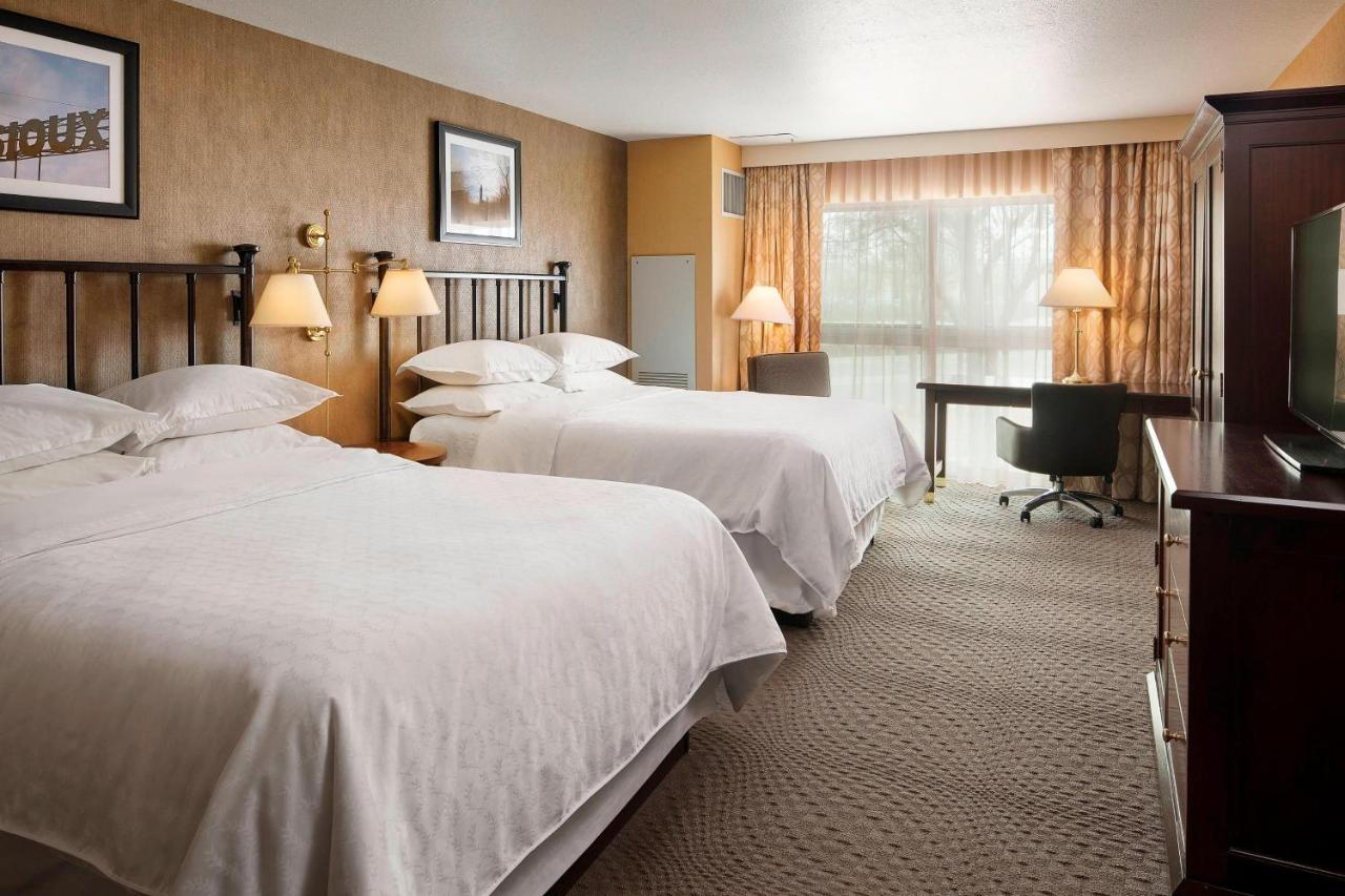 Larger Guest room, 2 Queen at Sheraton Sioux Falls Hotel & Convention Center