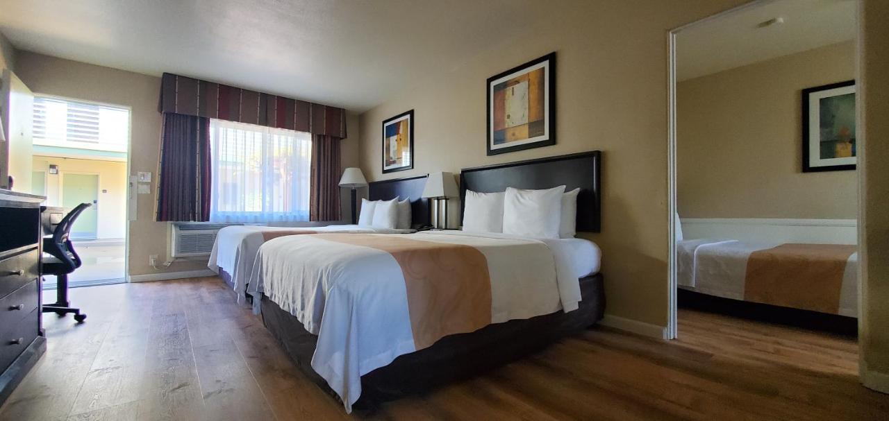 Family Suite, 2 Queen Beds, 1 Double Bed, Non Smoking at Quality Inn & Suites Anaheim At The Park