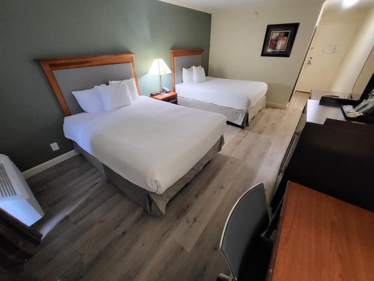 Queen Room with Two Queen Beds - Non-Smoking at Ramada by Wyndham Houston Intercontinental Airport East