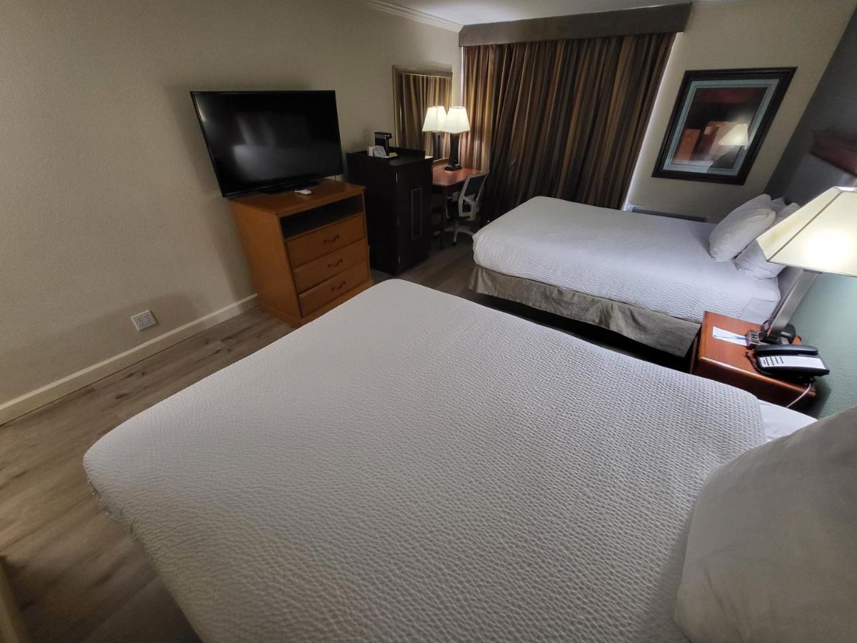 Queen Room with Two Queen Beds - Non-Smoking at Ramada by Wyndham Houston Intercontinental Airport East