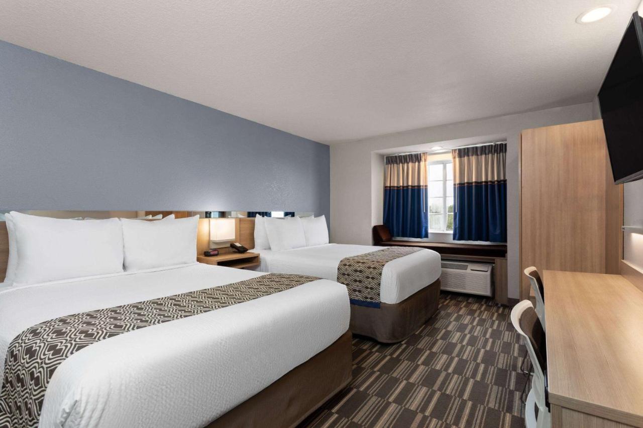 Queen Room with Two Queen Beds - Non-Smoking at Microtel Inn & Suites by Wyndham Zephyrhills
