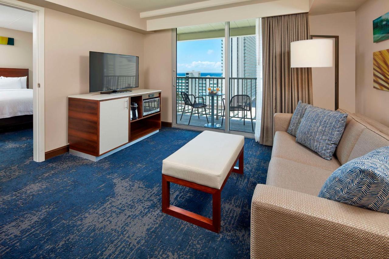 Suite with Two Double Beds and One Sofa Bed with Partial Ocean View at Hilton Garden Inn Waikiki Beach