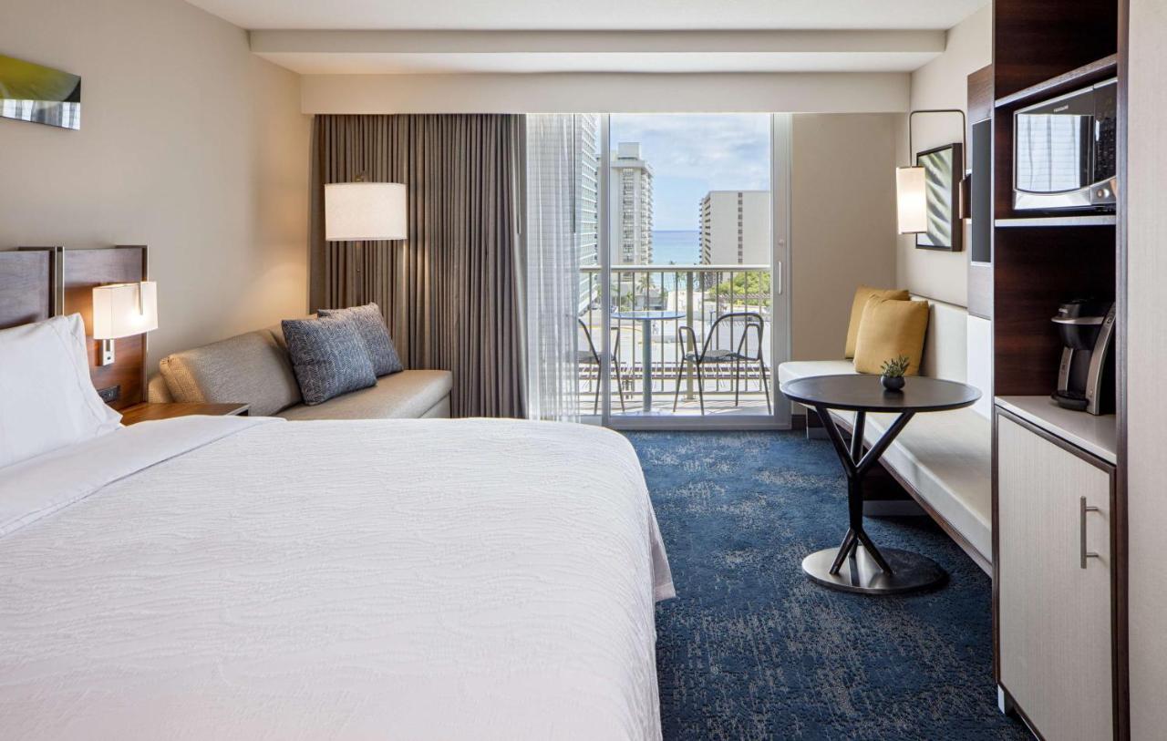 King Room with Sofa Bed with Partial Ocean View at Hilton Garden Inn Waikiki Beach