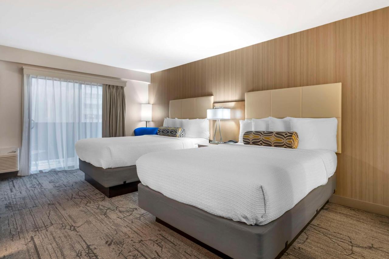 Queen Room with Two Queen Beds and Patio at Best Western Red Coach Inn